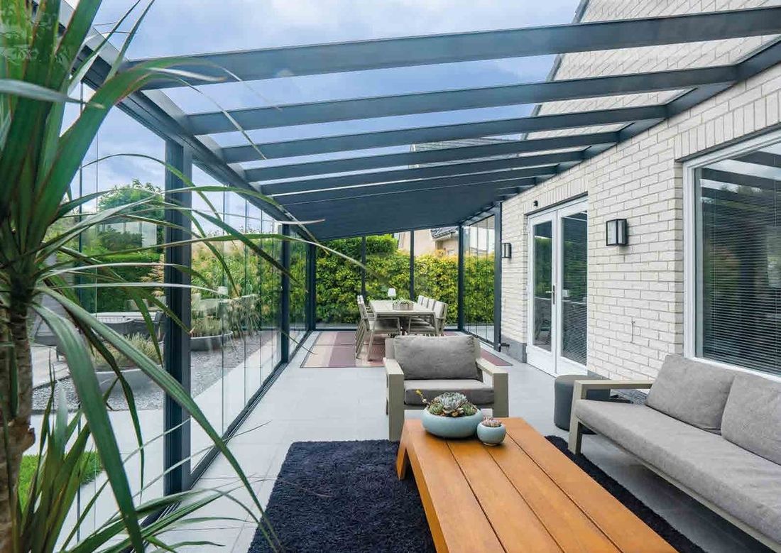 Aluminium veranda garden room with integrated drainage and sliding glass walls