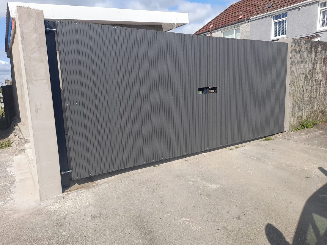 Modern low-maintenance sliding gate in a contemporary grey finish