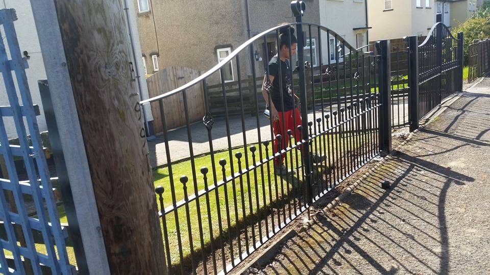 Lloyds Fabrications team fitting wrought iron railings on site
