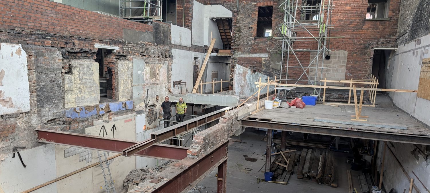 Structural steel beam installed through a heritage building during renovation